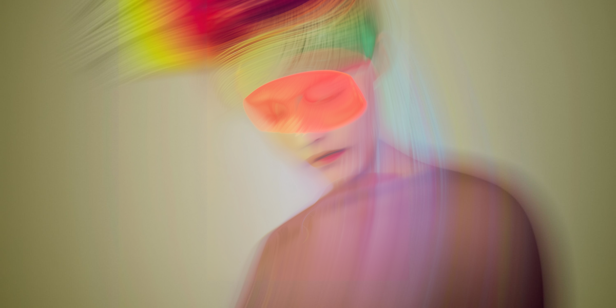 Blurred image of a person with their eyes masked to depict BDSM as an accessible world of pleasure for disabled people